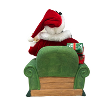 Load image into Gallery viewer, Santa on Green Sofa Holding Christmas List
