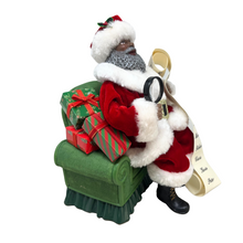 Load image into Gallery viewer, Santa on Green Sofa Holding Christmas List
