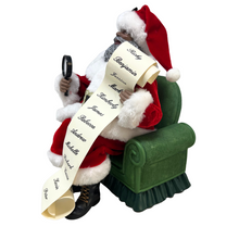 Load image into Gallery viewer, Santa on Green Sofa Holding Christmas List
